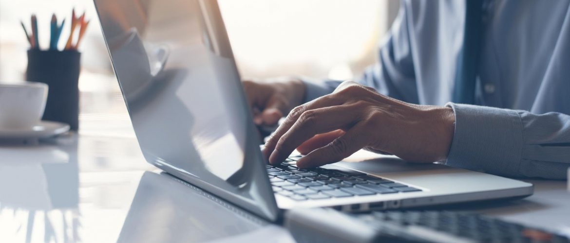 A guy using laptop for e-learning